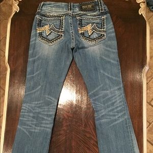 RESERVED Size 26 boot cut med wash miss me jeans